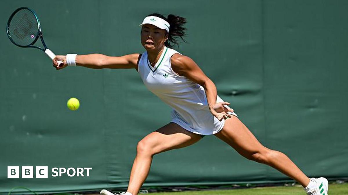 Mimi Xu returns a shot in the semi-finals of the girls' singles at Wimbledon