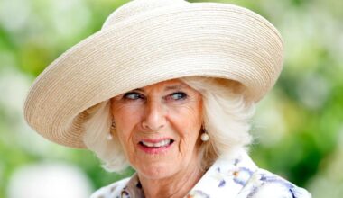Queen Camilla arrives at Wimbledon in bespoke animal print dress