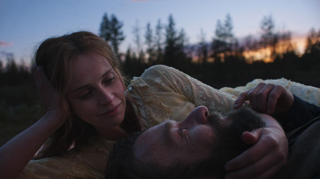man and woman lying on ground