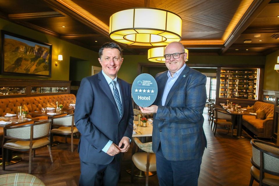 David Roberts of Tourism NI and Stephen Meldrum of Dunluce Lodge, inside the hotel's restaurant