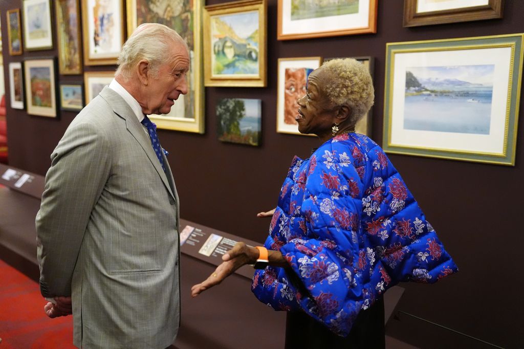  King Charles III speaks with Claudette Johnson