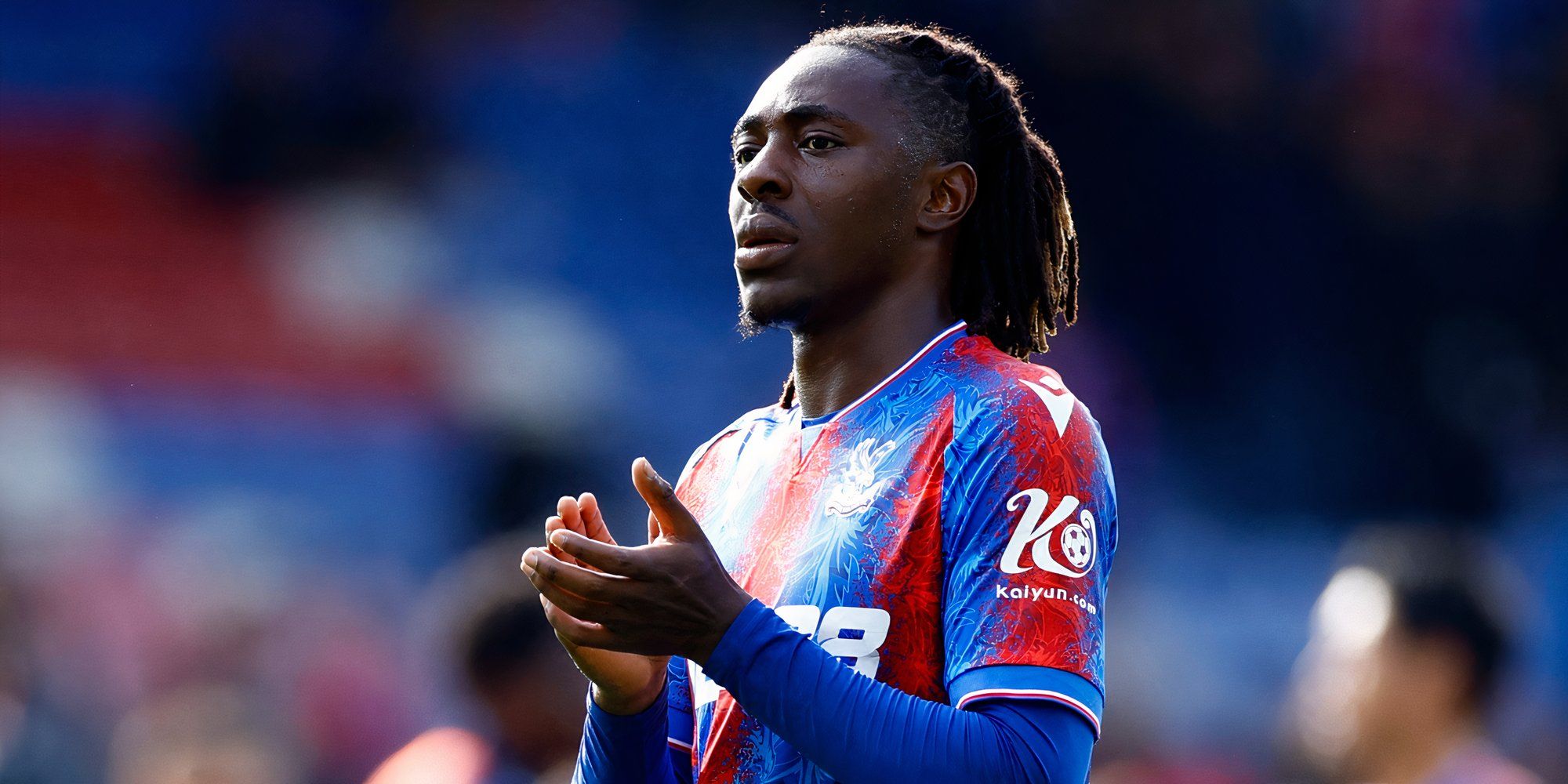 Crystal Palace winger Eberechi Eze applauding the supporters