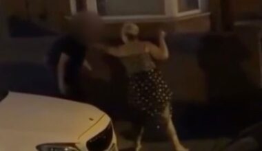Disturbing footage shows a knife-wielding woman wildly swinging a blade while trying to slash a man in the street - before he fended her off with his rucksack.