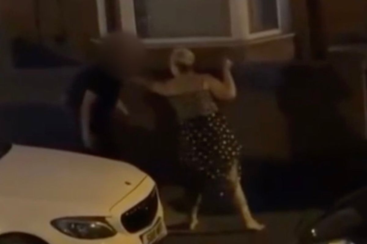 Disturbing footage shows a knife-wielding woman wildly swinging a blade while trying to slash a man in the street - before he fended her off with his rucksack.