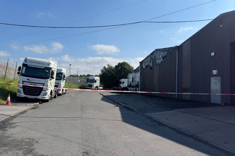 A fire service cordon is in place by the Chambers & Cook Freight Ltd building in Perrywell Road, Witton where a fire took hold in the early morning