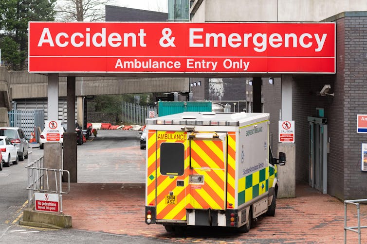 An ambulance pulling up outside an A&E department.