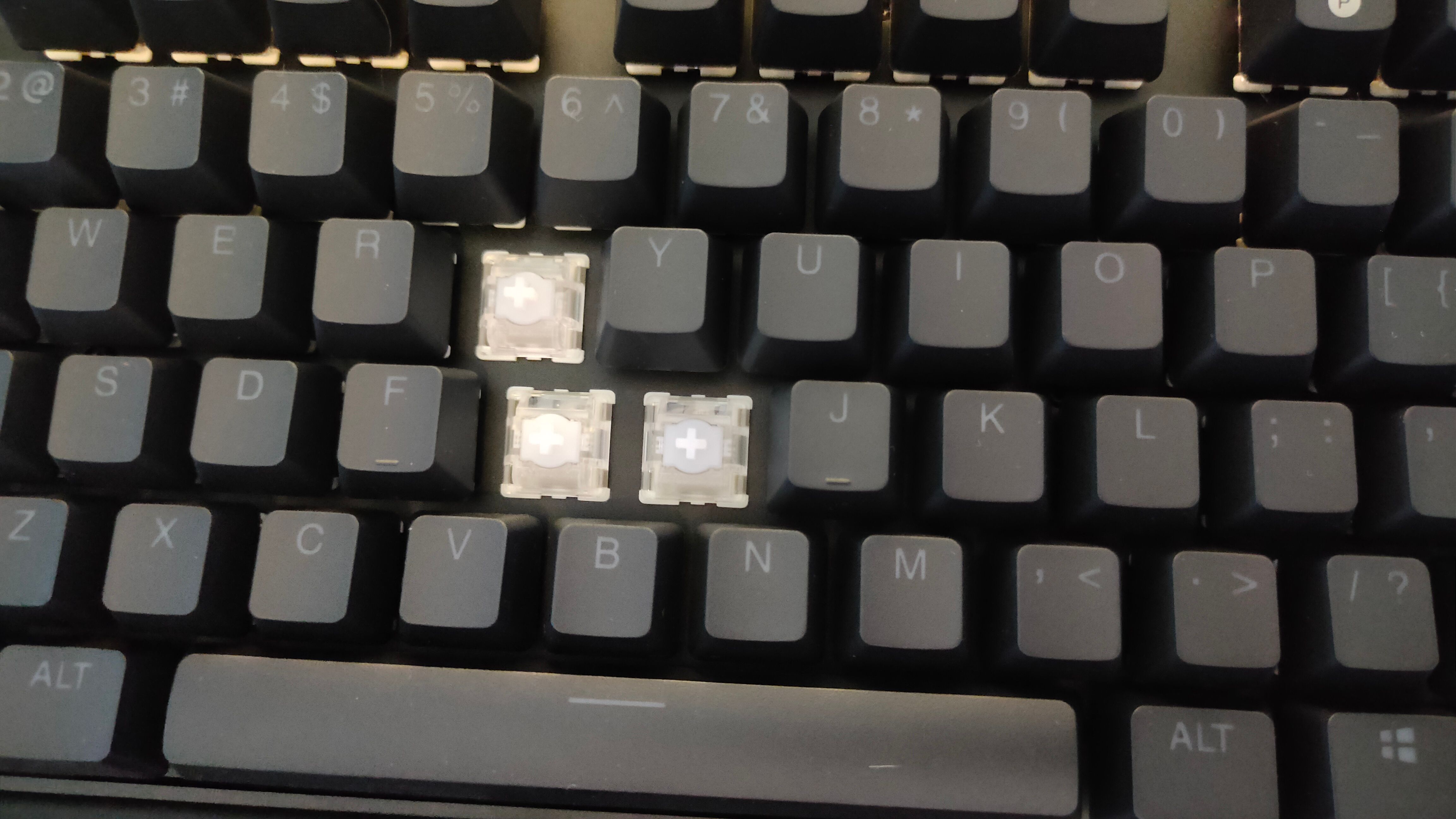 The HTG keycaps removed from the Gateron Hall Effect switches on the SteelSeries Apex Pro Gen 3 TKL Wireless.