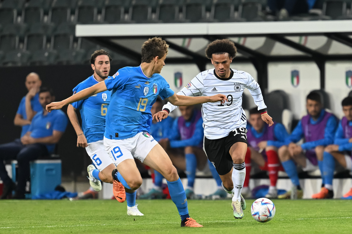Leroy Sane of Germany challenges Giorgio Scalvini of Italy during the UEFA Nations League League A Group 3 match between Germany and Italy at Borussia Park Stadium on June 14, 2022 in Moenchengladbach, Germany. (Photo by Christian Kaspar-Bartke/Getty Images)