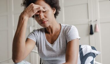 Woman holding the bridge of her nose while feeling stressed