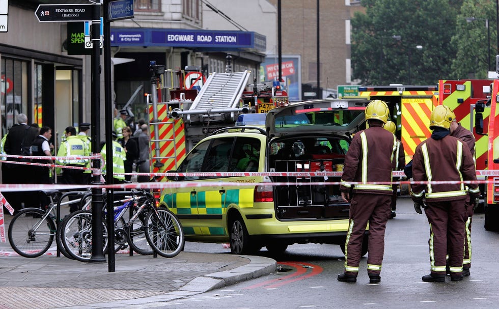 london july 7: members of the london fire service secure the area around edgware road underground station after several bomb blasts ripped across londons underground network on july 7, 2005 in london, england. three explosions on the underground left at least 37 people dead, and many more injured. prime minister tony blair who returned from the g8 summit described the attack as barbaric. (photo by gareth cattermole/getty images)