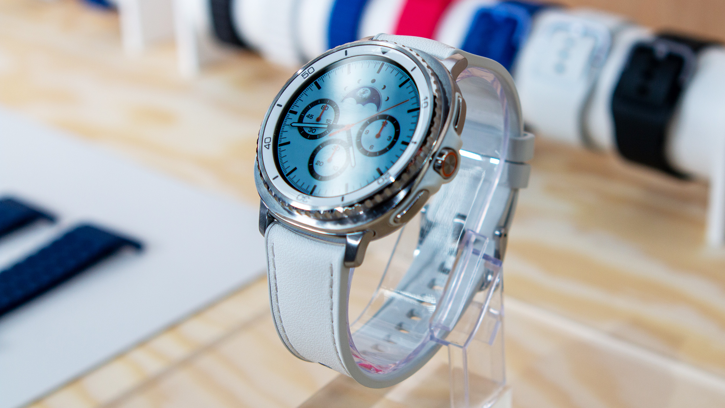 Samsung Galaxy Watch 8 Classic sitting on a pedestal, showing a watch face in AOD mode