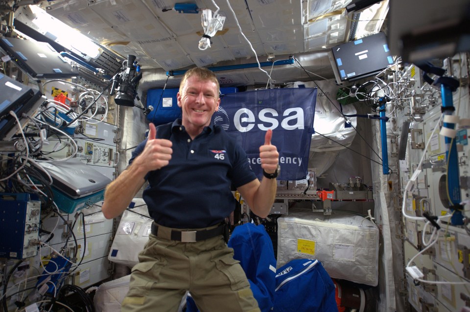 Astronaut giving thumbs up on the International Space Station.