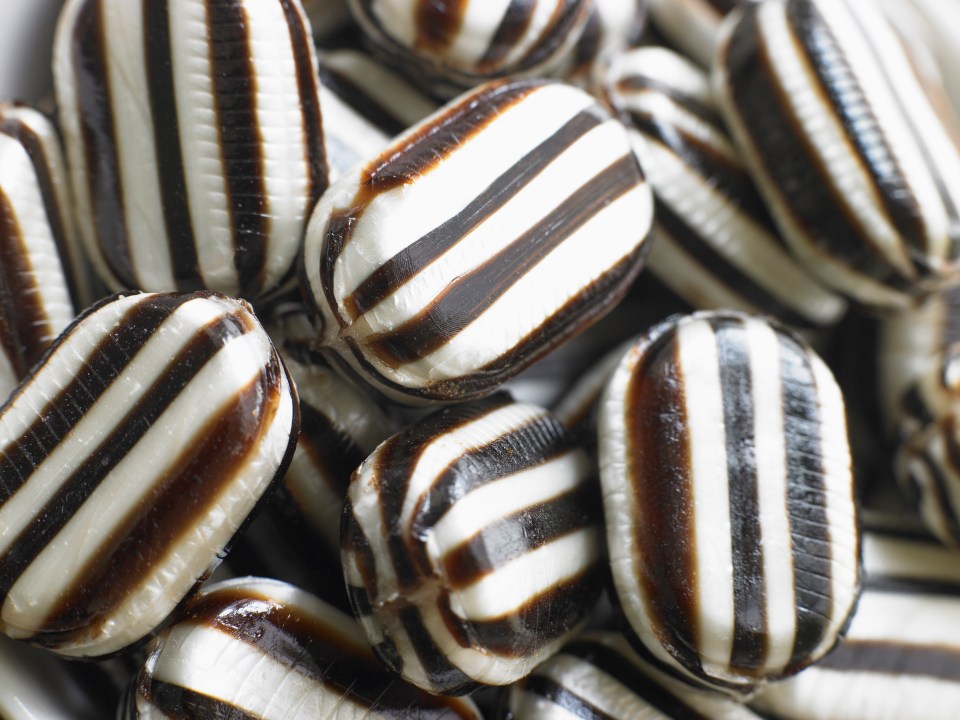 Close-up of black and white striped hard candies.