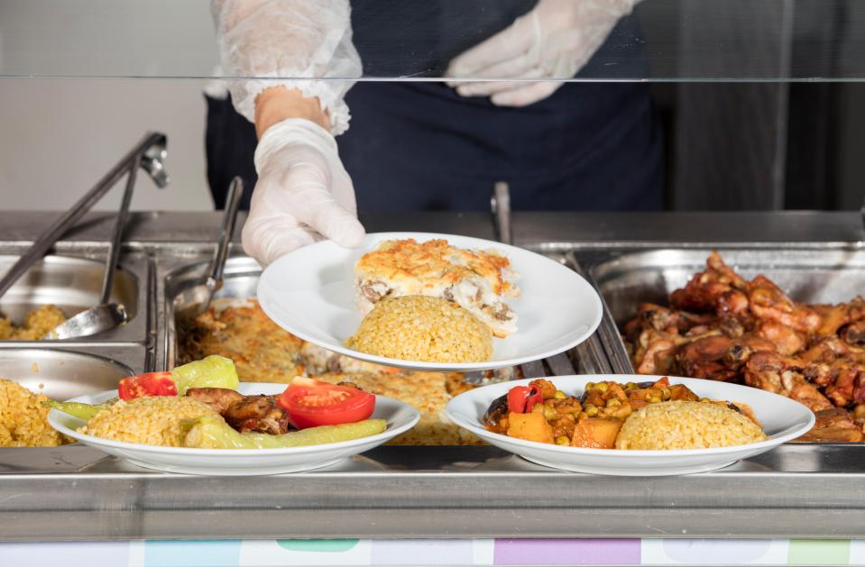 Self-service buffet with various food options.