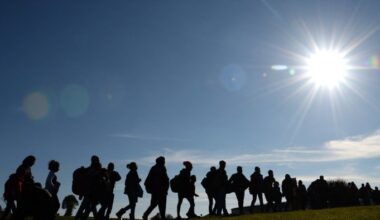 Migrants are on their way from the Austrian-German border to the first registration point of the German federal police near the small Bavarian village Wegscheid, southern Germany