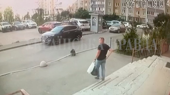 A screen grab of CCTV footage showing Security Service of Ukraine (SBU) officer Col Ivan Voronych walking down the stairs moments before he was shot in Kyiv