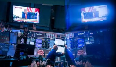 A television broadcasts US President Donald Trump on the floor of the New York Stock Exchange