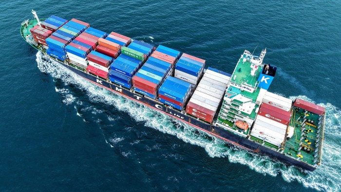 A cargo ship loaded with containers leaves the port in Qingdao, eastern China