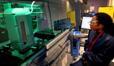 A Moderna research associate conducts quality control