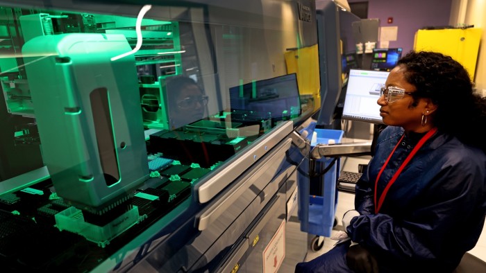 A Moderna research associate conducts quality control
