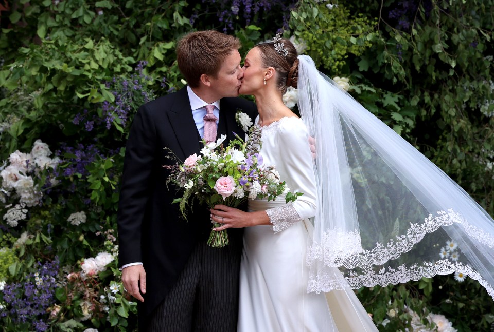 The Duke and Duchess of Westminster kissing after their wedding ceremony.