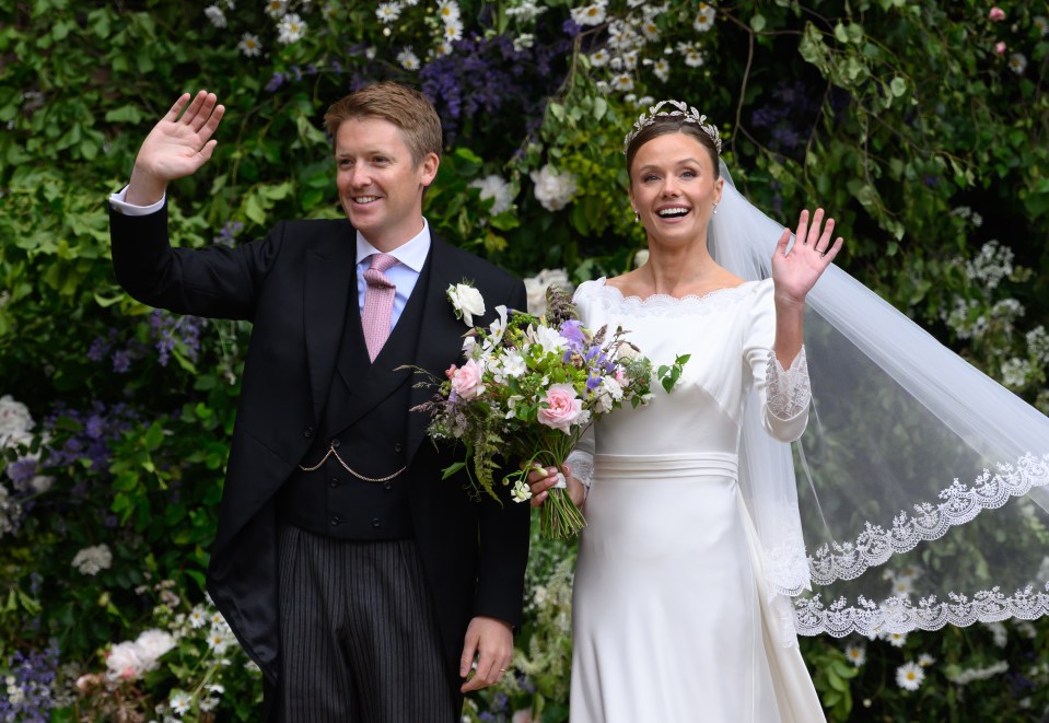 The Duke and Duchess of Westminster waving to well-wishers after their wedding ceremony.