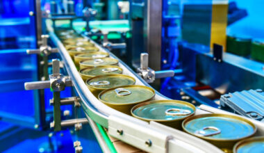 A manufacturing plant production line with tins.