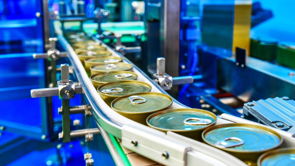 A manufacturing plant production line with tins.