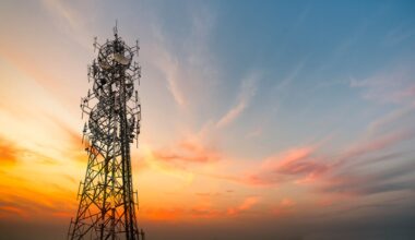 5G Sunset Cell Tower: Cellular communications tower for mobile phone and video data transmission