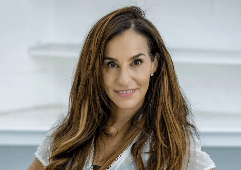 Portrait of a woman with long brown hair.