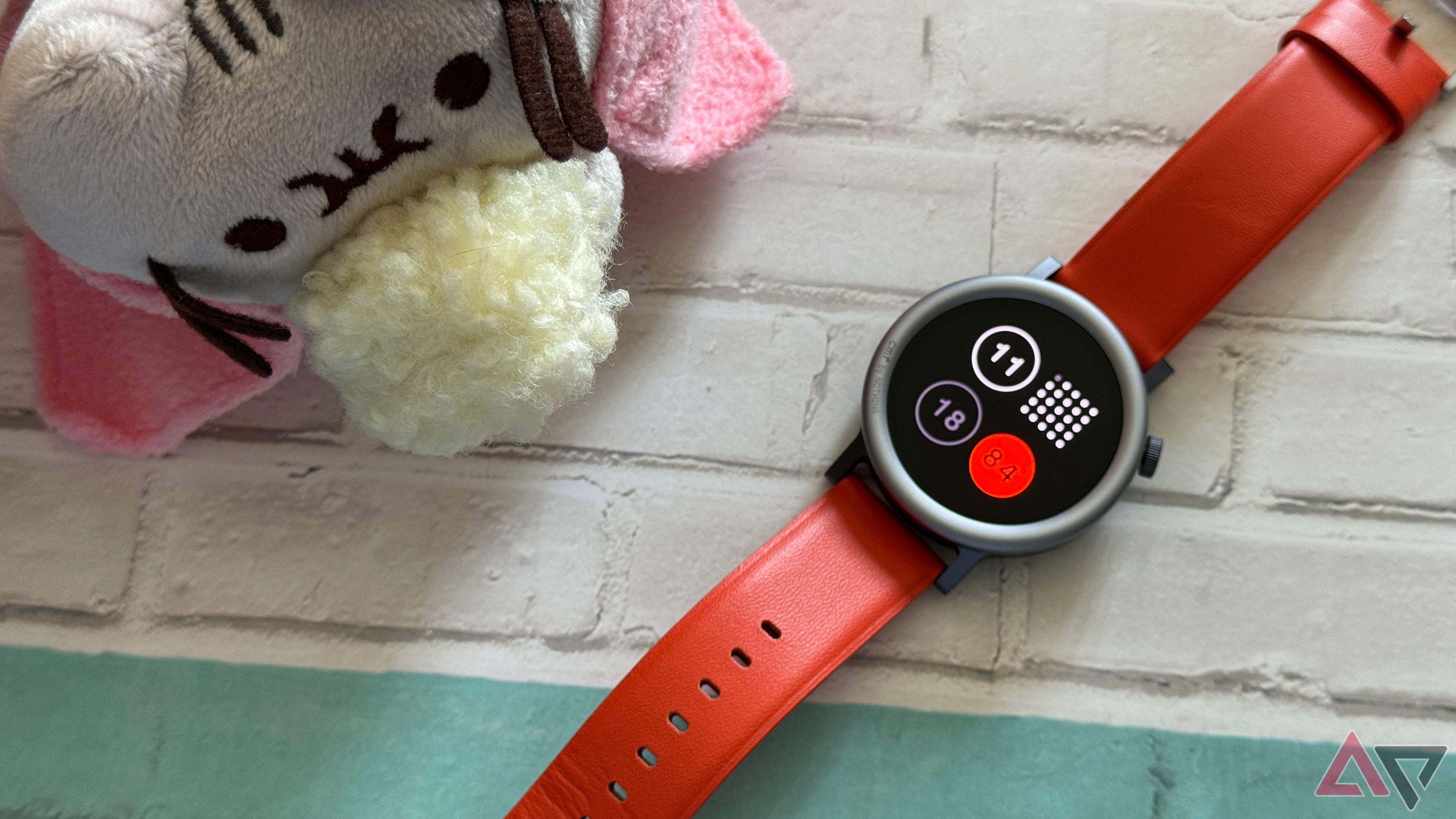 CMF Watch Pro 2 in orange under the watchful eye of a Pusheen