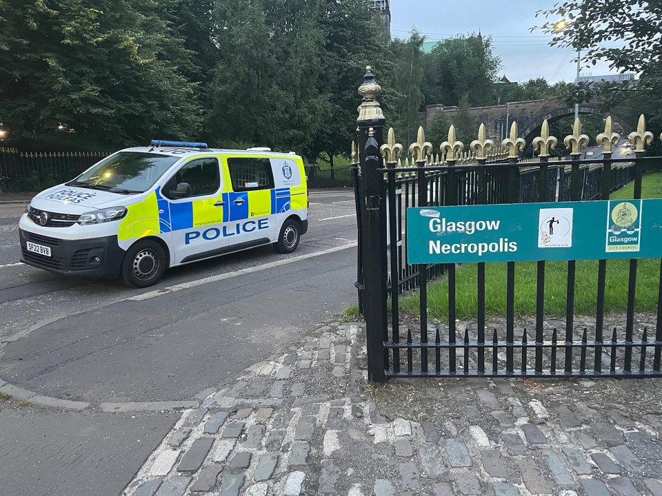 Police van at the entrance to Glasgow Necropolis.