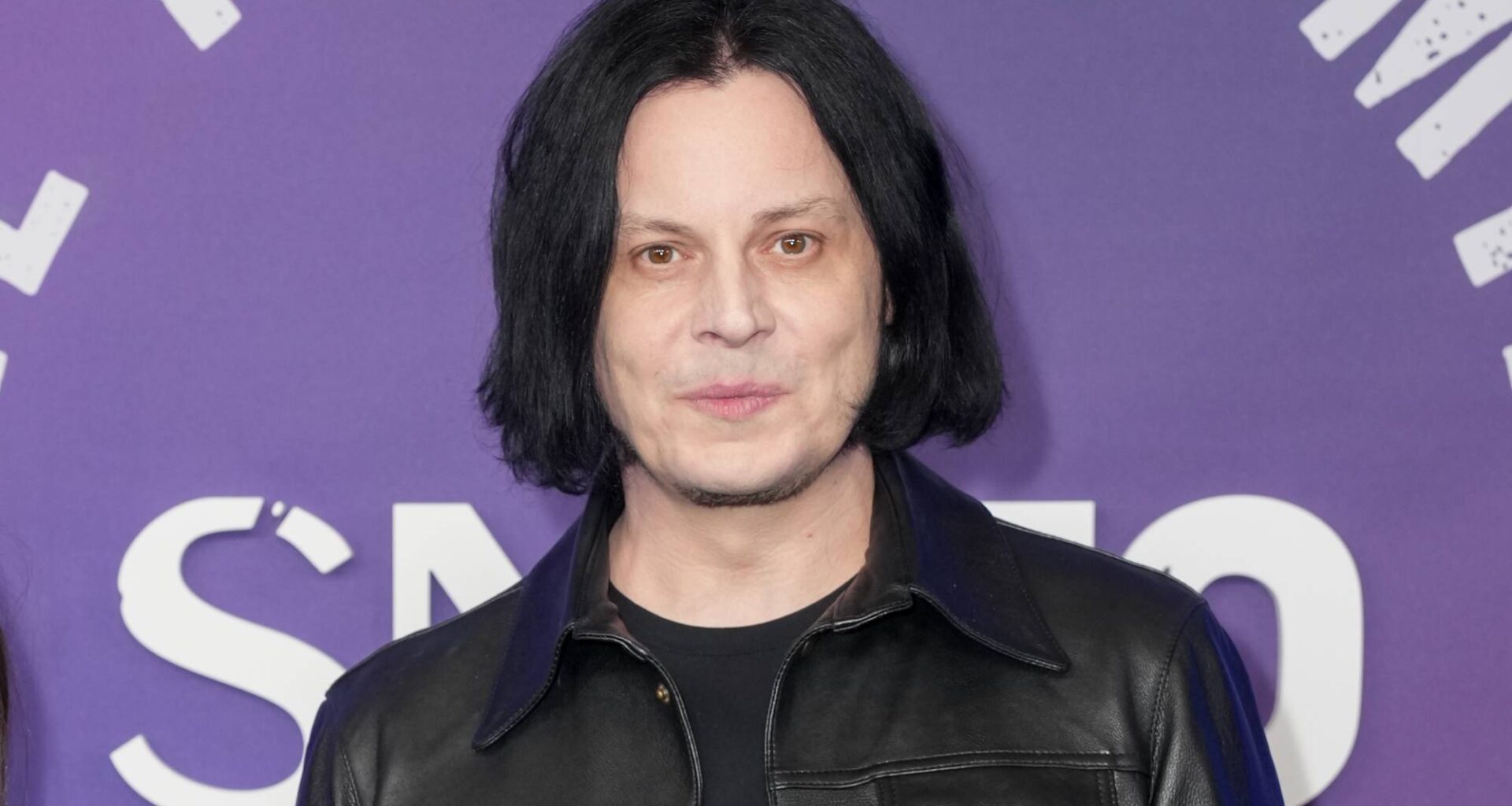 Jack White becomes “reluctant owner of a cellular telephone for first time” on 50th birthday
