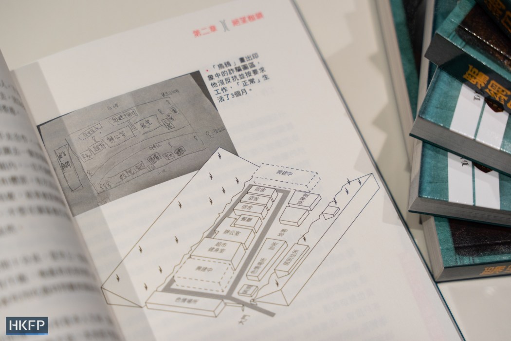 A depiction of a Myanmar scam compound, pictured in the book "No Way Out: Modern Slavery Behind the Scam Curtain," at a launch event on July 5, 2025. Photo: Kyle Lam/HKFP.