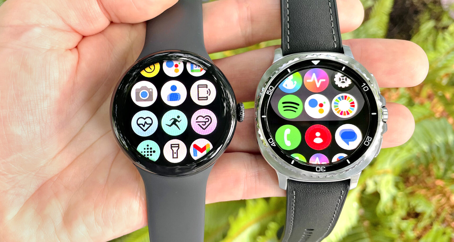Close up of the Google Pixel Watch 3 XL next to the Samsung Galaxy Watch 8 Classic; both are in a user's hand