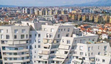 studio libeskind & kontakt weave public gardens through curved residences in tirana