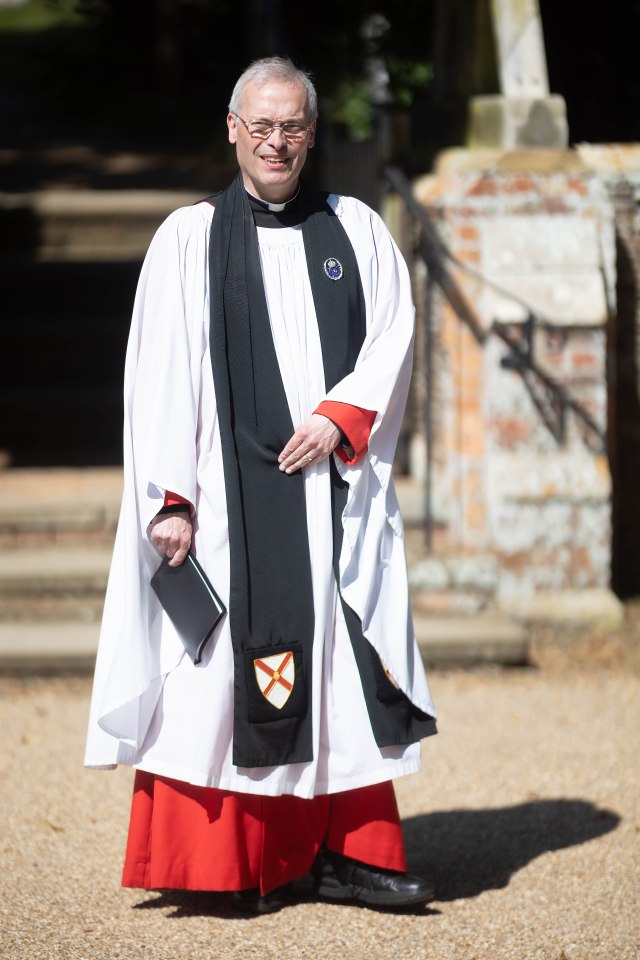 Clergy member in robes at Sandringham.