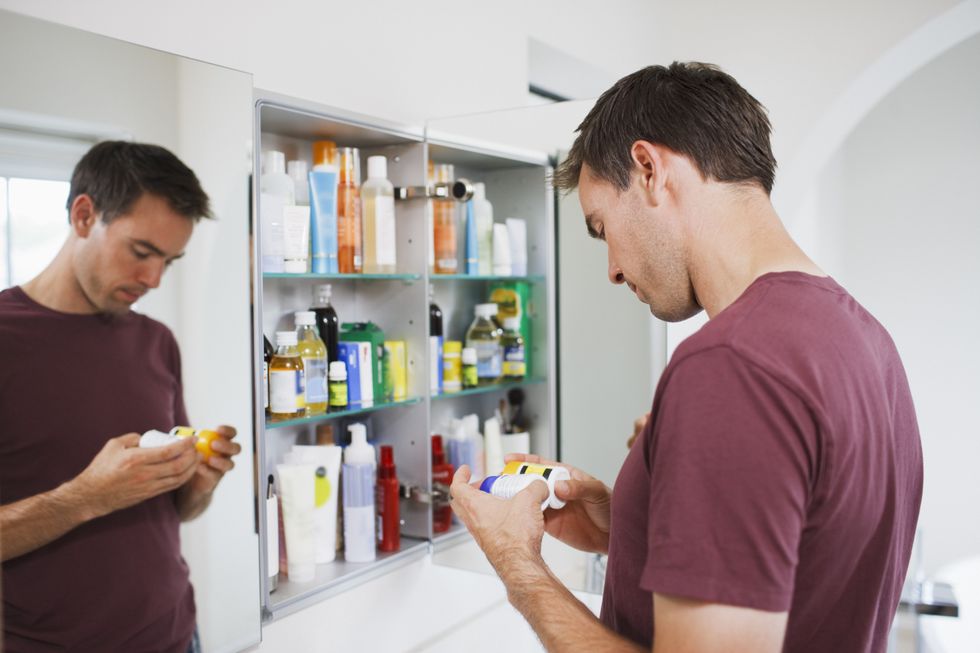 Man checking medication label