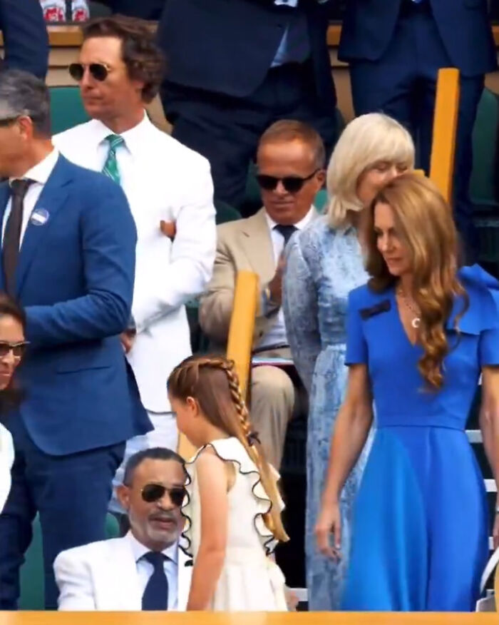 Matthew McConaughey wearing white suit and sunglasses at Wimbledon final, hailed as gentleman for his gesture to British royalty.