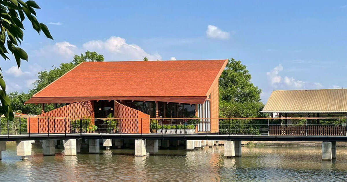 clad in terracotta tiles, morjor café by studio bewell floats above water pond in thailand