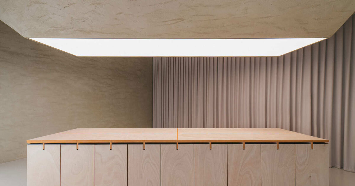 modular table reforms into exhibition platform within ceramic workshop by AACM