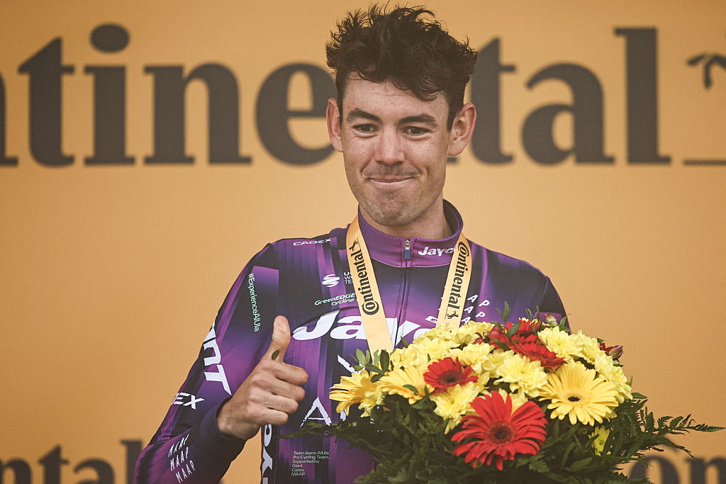 Team Jayco AlUla team's Australian rider Ben O'Connor celebrates on the podium after winning the 18th stage of the 112th edition of the Tour de France cycling race, 171.5 km between Vif and Courchevel Col de la Loze, in the Alps, southeastern France, on July 24, 2025. (Photo by Anne-Christine POUJOULAT / AFP) (Photo by ANNE-CHRISTINE POUJOULAT/AFP via Getty Images)