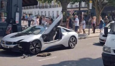 BMW passenger wrestles with passersby after crash on London street