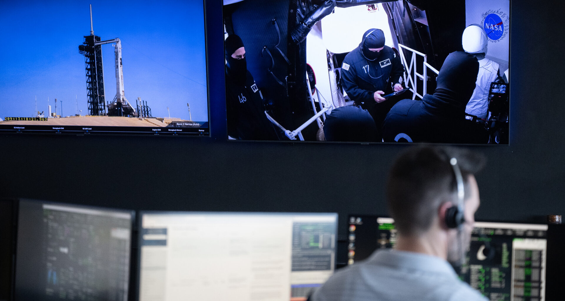 Monitors show a SpaceX Falcon 9 rocket carrying the company's Dragon spacecraft and members of the closeout crew during a dress rehearsal in preparation for the launch of NASA’s SpaceX Crew-11 mission.