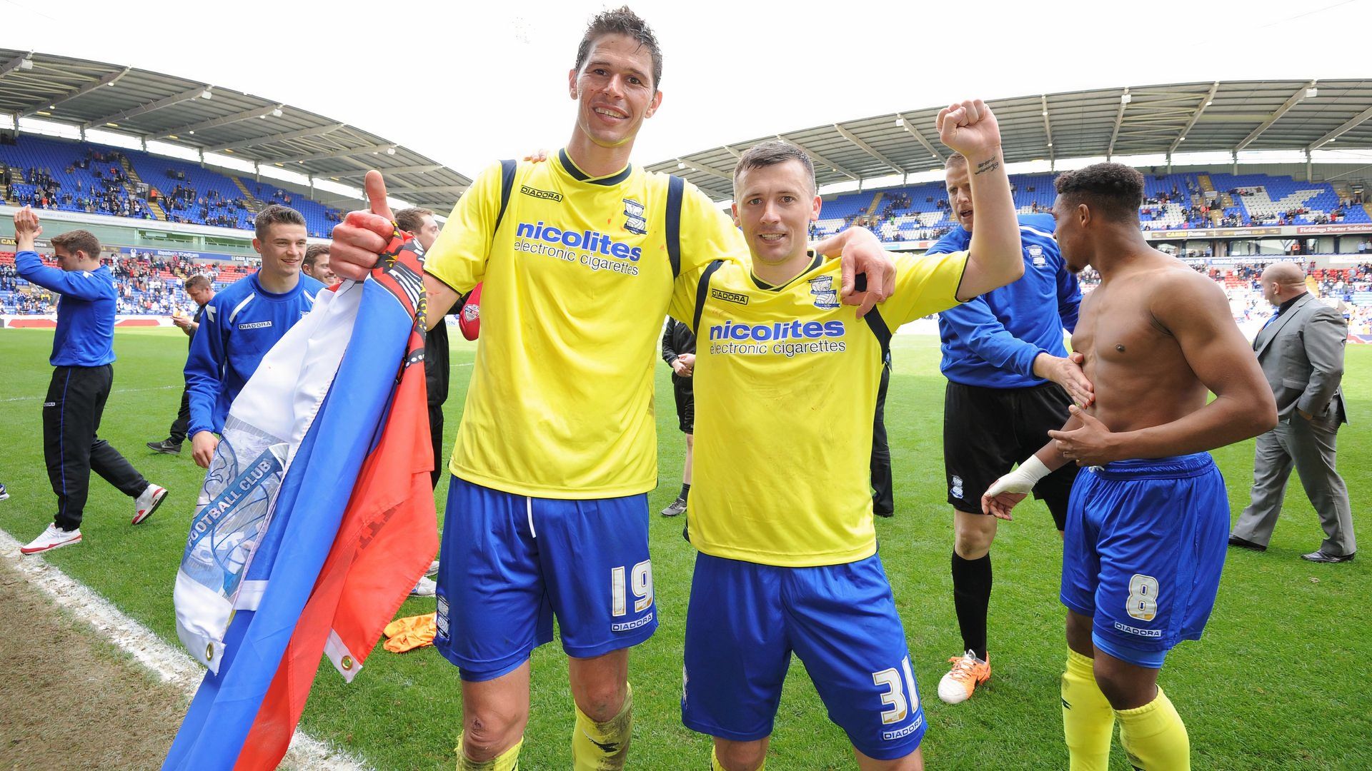 Nikola Zigic and Paul Caddis after Birmingham City's 2014 survival