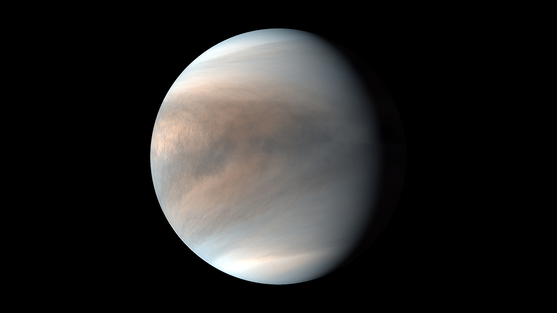 An image of Venus, with brown and gray swirling clouds on its surface