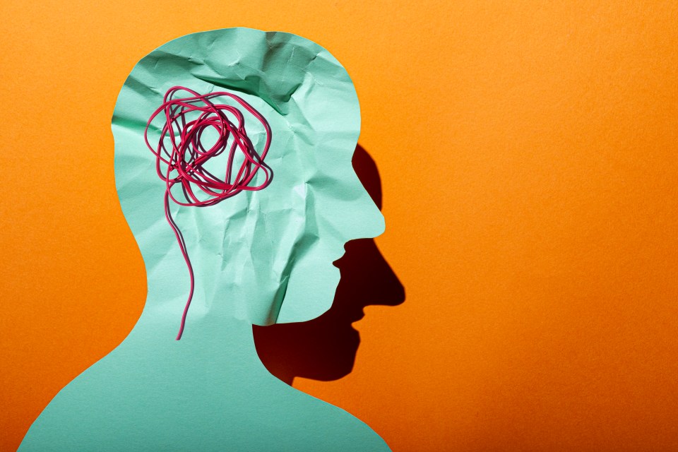 Illustration of a crumpled paper head silhouette with tangled red string inside, representing confusion.