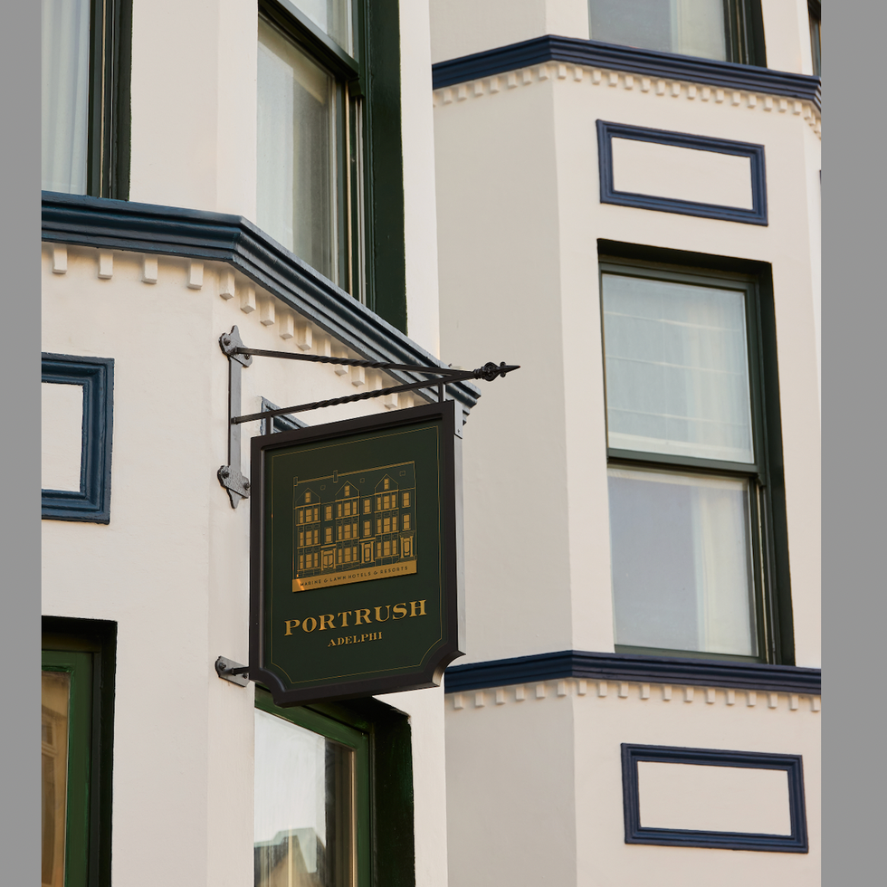 portrush adelphi exterior with a sign