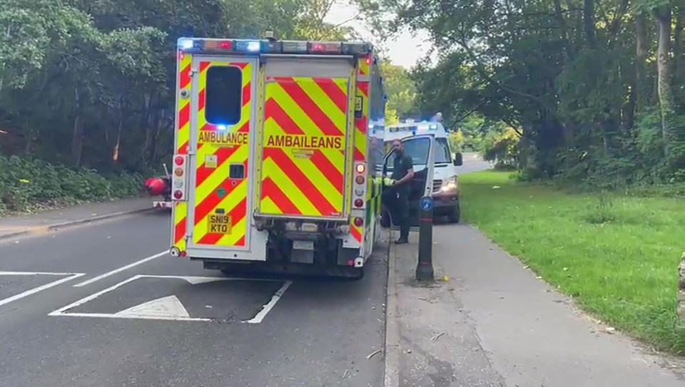 Ambulance and paramedic at a possible incident near a river.