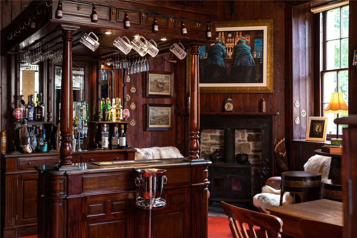 A dark wood panneled old-fashioned pub or tavern